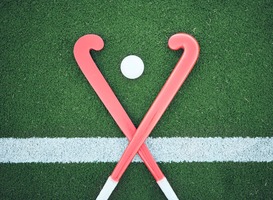 Normal_turf-field-hockey-stick-or-sports-ball-on-the-gro-2023-01-04-20-16-37-utc__1_