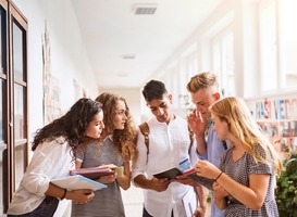 Normal_teenage-students-in-high-school-hall-talking-2021-08-26-12-07-33-utc__1_