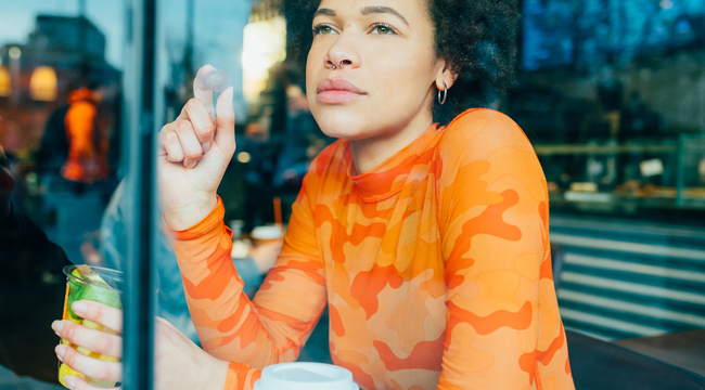 Carousel_young-black-curly-woman-sitting-bar-eating-fruit-s-2022-04-11-15-18-11-utc