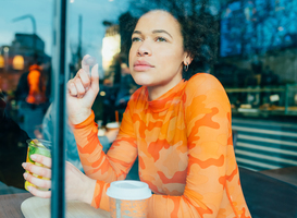 Normal_young-black-curly-woman-sitting-bar-eating-fruit-s-2022-04-11-15-18-11-utc