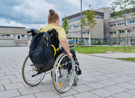 Normal_back-view-child-preteen-boy-on-wheelchair-going-t-2023-08-22-04-59-59-utc