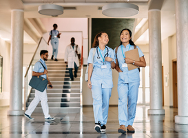 Normal_happy-female-medical-students-walking-through-hall-2023-02-02-19-02-20-utc