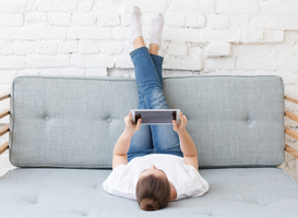 Normal_pretty-young-woman-laying-on-couch-in-loft-interio-2023-11-27-04-57-31-utc