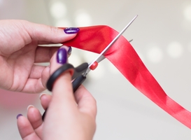 Normal_woman-cuts-the-opening-ribbon-2023-11-27-05-09-19-utc