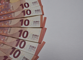 Normal_closeup-shot-of-a-pile-of-ten-euro-banknotes-2023-11-27-05-12-44-utc