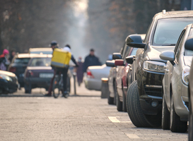 Normal_city-traffic-with-cars-parked-in-line-on-street-si-2023-11-27-05-33-16-utc