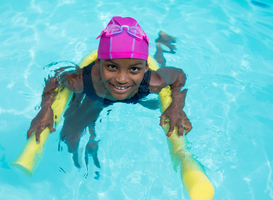 Normal_high-angle-view-of-girl-swimming-with-pool-noodle-2023-11-27-04-51-03-utc