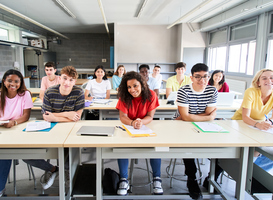 Normal_smiling-group-university-college-sitting-at-classr-2023-11-27-05-24-27-utc