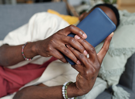 Normal_hands-of-young-man-with-smartphone-2024-01-24-21-13-11-utc