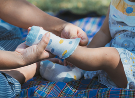 Normal_close-up-of-caring-asian-mother-putting-tiny-socks-2024-01-08-22-45-30-utc