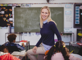 Normal_portrait-of-teacher-helping-schoolkids-with-their-2023-11-27-05-27-34-utc