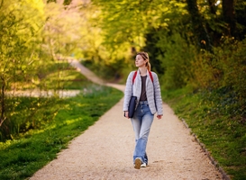 Normal_young-blonde-girl-in-spring-outfit-walks-in-green-2023-11-27-05-13-14-utc