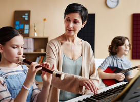 Normal_teacher-playing-musical-instruments-with-student-2023-11-27-04-59-38-utc