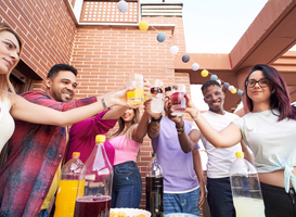 Normal_group-of-happy-friends-toasting-with-drinks-while-2023-11-27-05-10-13-utc