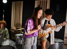Normal_focus-on-jolly-teenage-boy-and-girl-singing-and-pl-2024-02-19-23-52-06-utc