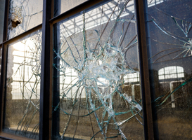 Normal_thick-broken-glass-of-a-window-in-an-abandoned-ind-2023-11-27-05-29-00-utc