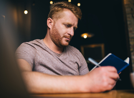 Normal_man-reading-and-taking-notes-2024-05-20-18-51-51-utc