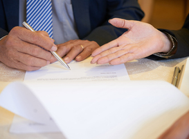 Normal_business-partners-signing-documents-2023-11-27-05-22-08-utc