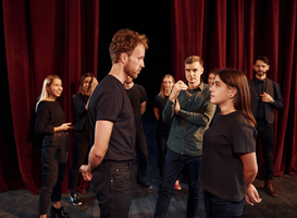 Normal_eye-contact-practice-group-of-actors-in-dark-colo-2023-11-27-05-26-41-utc