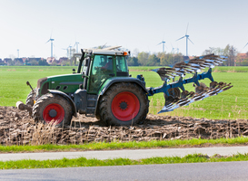 Normal_tractor-with-plowes-on-the-spring-field-2023-11-27-04-50-29-utc