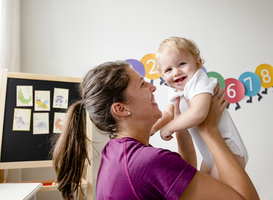 Normal_mother-carrying-and-playing-with-her-baby-2023-11-27-04-55-57-utc