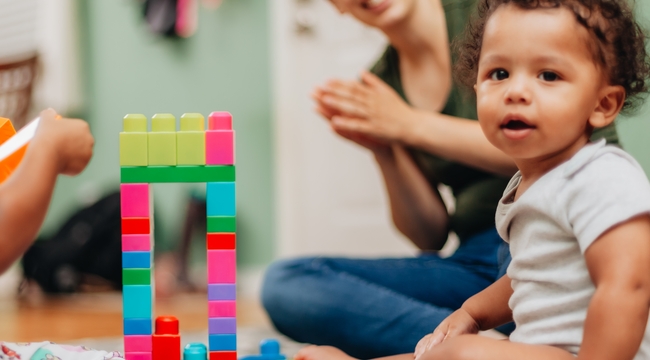 Carousel_mother-at-home-playing-along-with-kids-with-buildi-2024-11-01-02-33-28-utc
