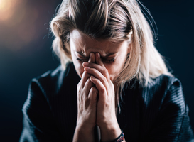 Normal_anxious-female-face-portrait-on-a-dark-background-2024-10-18-08-27-36-utc