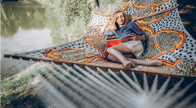 Carousel_stylish-hipster-woman-relaxing-in-hammock-in-sunny-2025-03-15-16-28-53-utc