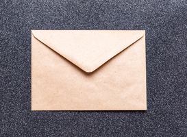 Normal_closed-brown-craft-envelope-on-dark-background-an-2025-03-09-11-56-18-utc