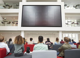Normal_students-watching-big-screen-in-university-atrium-2024-10-20-20-36-48-utc