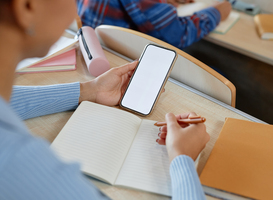 Normal_scoolgirl-writing-off-from-her-smartphone-at-exam-2025-03-05-12-31-30-utc
