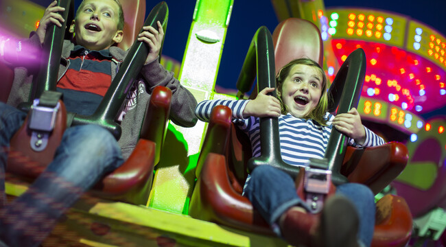 Carousel_sister-and-brother-on-fairground-ride-at-night-2025-04-04-06-27-49-utc