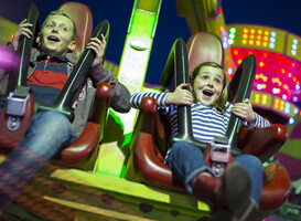 Normal_sister-and-brother-on-fairground-ride-at-night-2025-04-04-06-27-49-utc