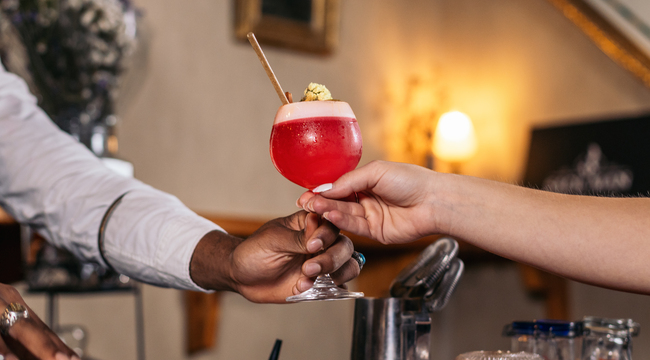 Carousel_cutout-of-a-black-bartender-offering-a-cocktail-se-2025-03-23-18-46-50-utc