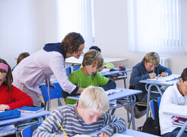 Normal_teacher-helping-boy-with-problem-in-classroom-2025-04-03-04-59-36-utc