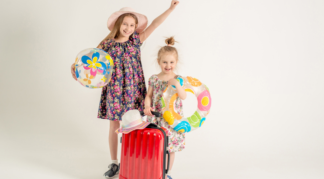 Carousel_happy-sisters-stand-near-a-suitcase-2025-04-01-13-15-36-utc