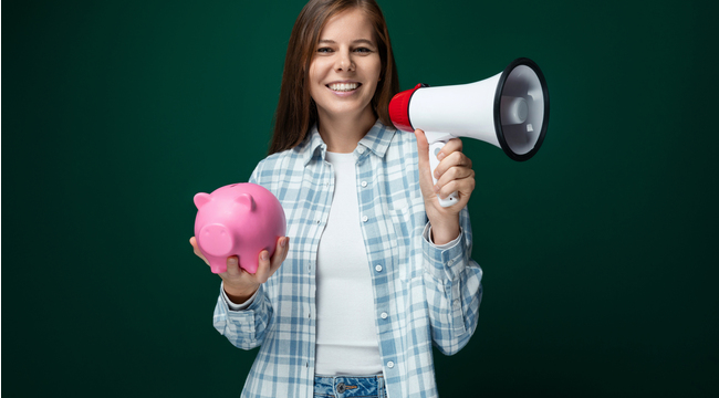Carousel_young-pretty-woman-holding-a-pink-piggy-bank-and-t-2025-02-12-18-38-16-utc