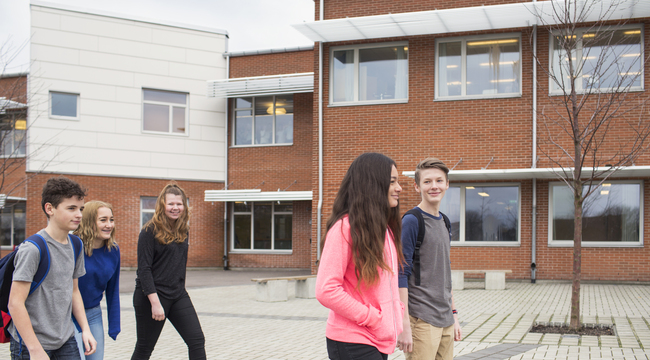 Carousel_children-12-13-in-front-of-school-building-2024-10-14-16-14-22-utc