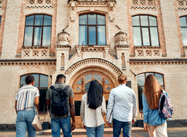 Normal_diverse-students-enter-university-with-academic-am-2025-03-26-22-01-21-utc