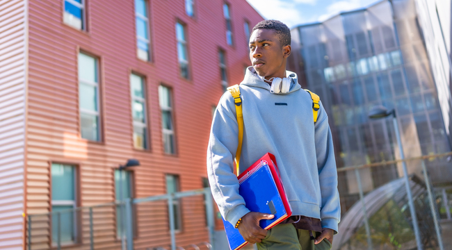 Carousel_confident-african-student-standing-outside-the-uni-2024-12-10-03-04-49-utc