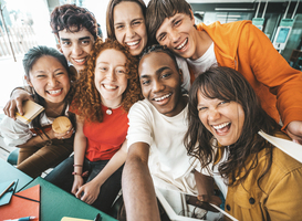 Normal_diverse-university-students-sitting-together-at-ta-2025-02-10-11-19-25-utc
