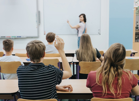 Normal_teacher-standing-in-front-of-the-class-room-full-o-2024-10-20-16-05-54-utc